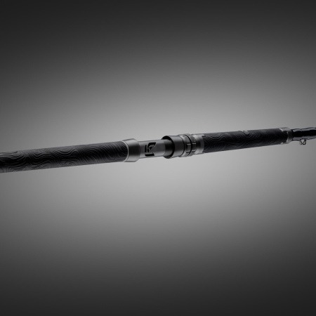 Low-angle view of the Hellcat Revenge Blackout Edition rod showing the butt section, grip texture, and reel-seat area against a dark gradient background.